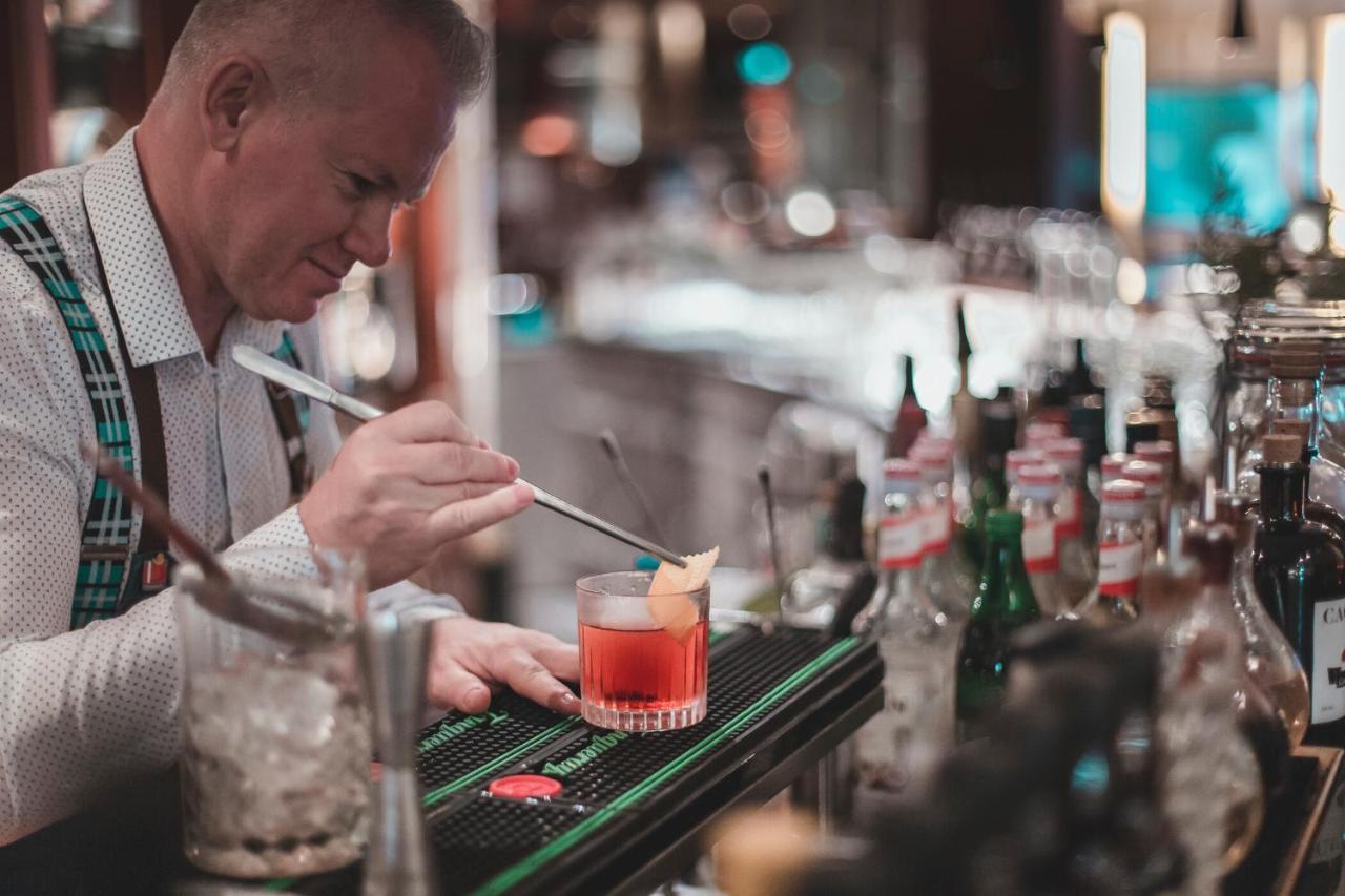 The Westin Grand Munich Hotel Exterior photo A bartender at work