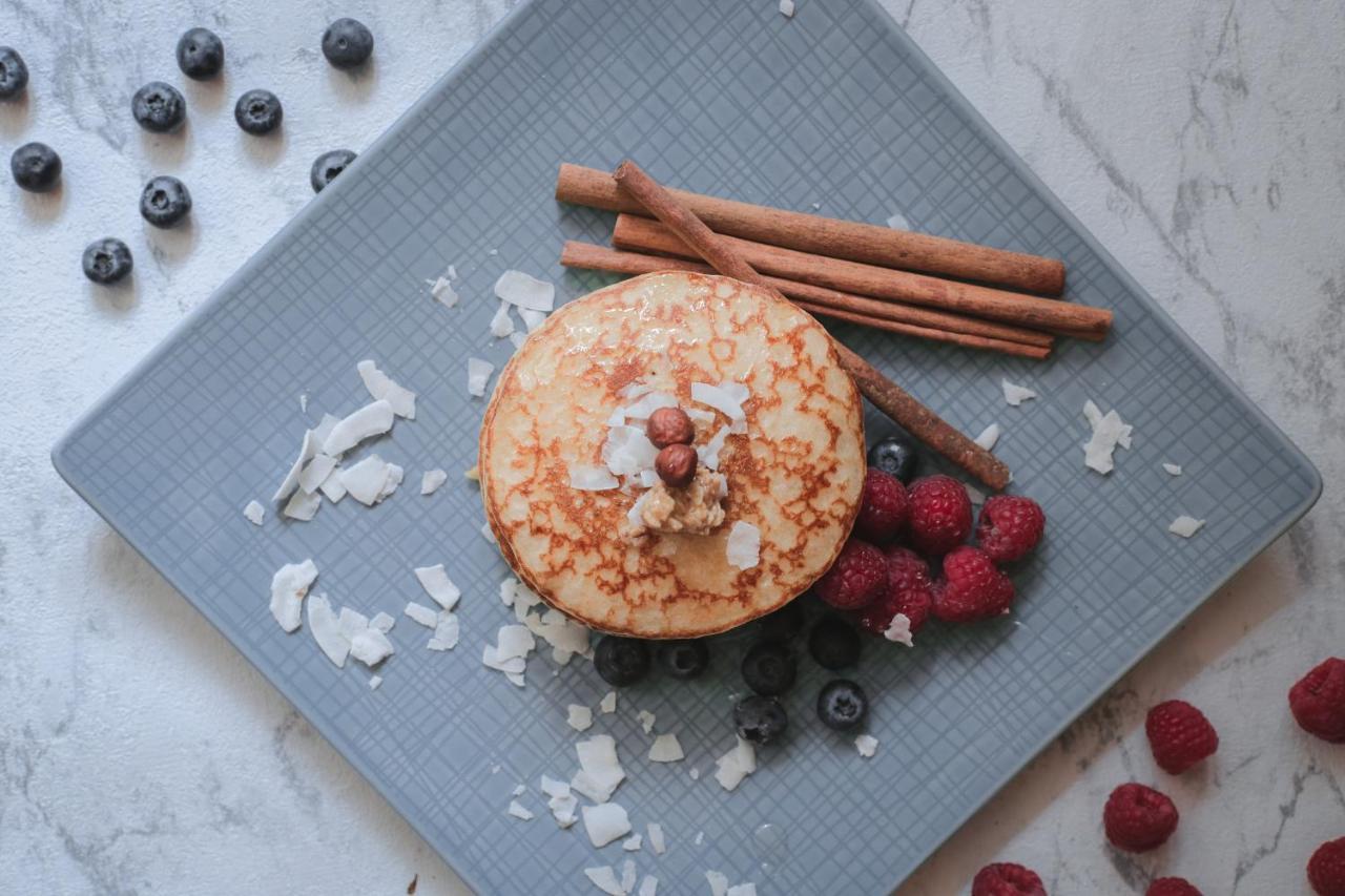 The Westin Grand Munich Hotel Exterior photo A pancake with cinnamon and raspberries