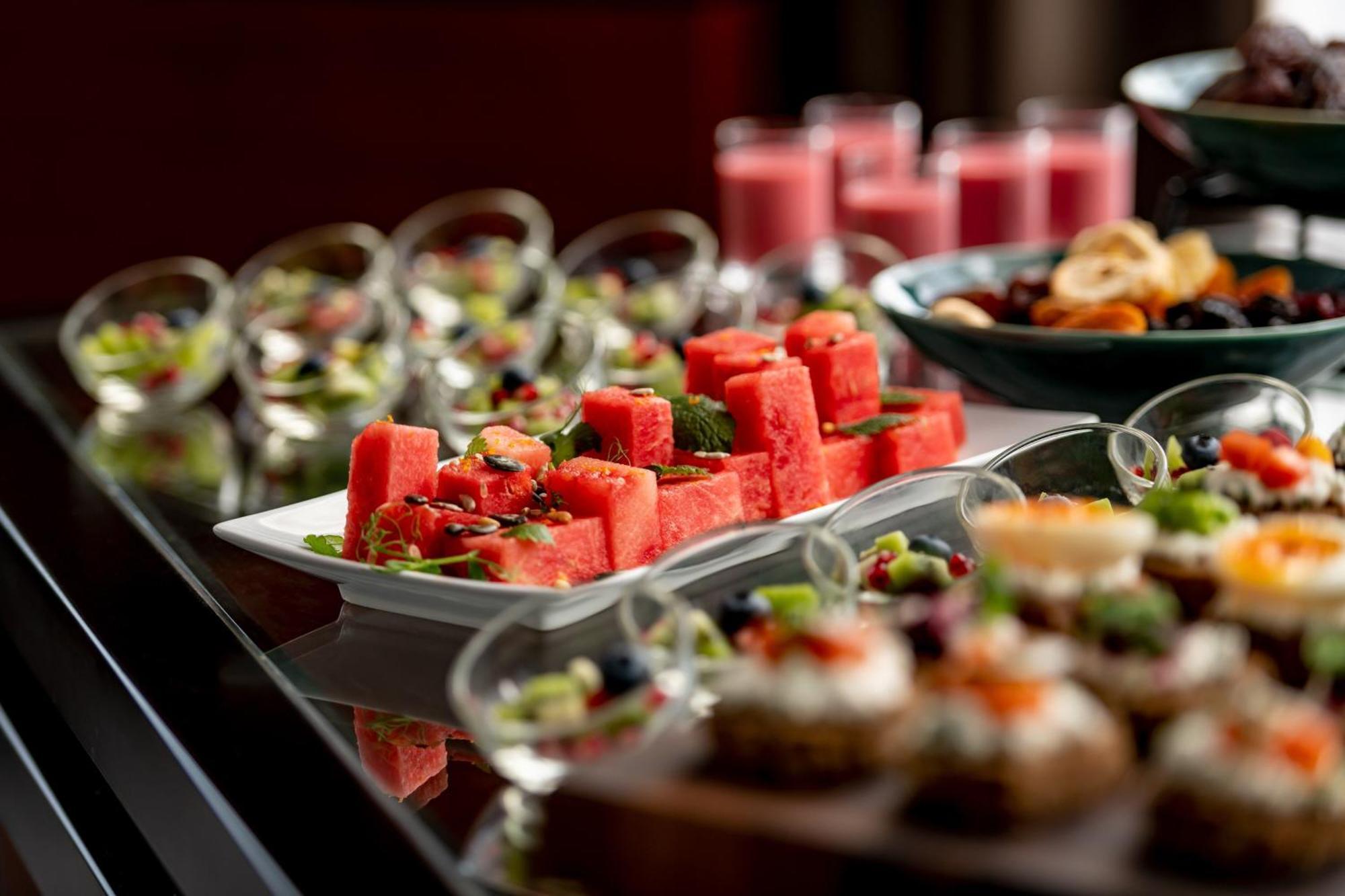 The Westin Grand Munich Hotel Exterior photo A buffet of fruit and juice