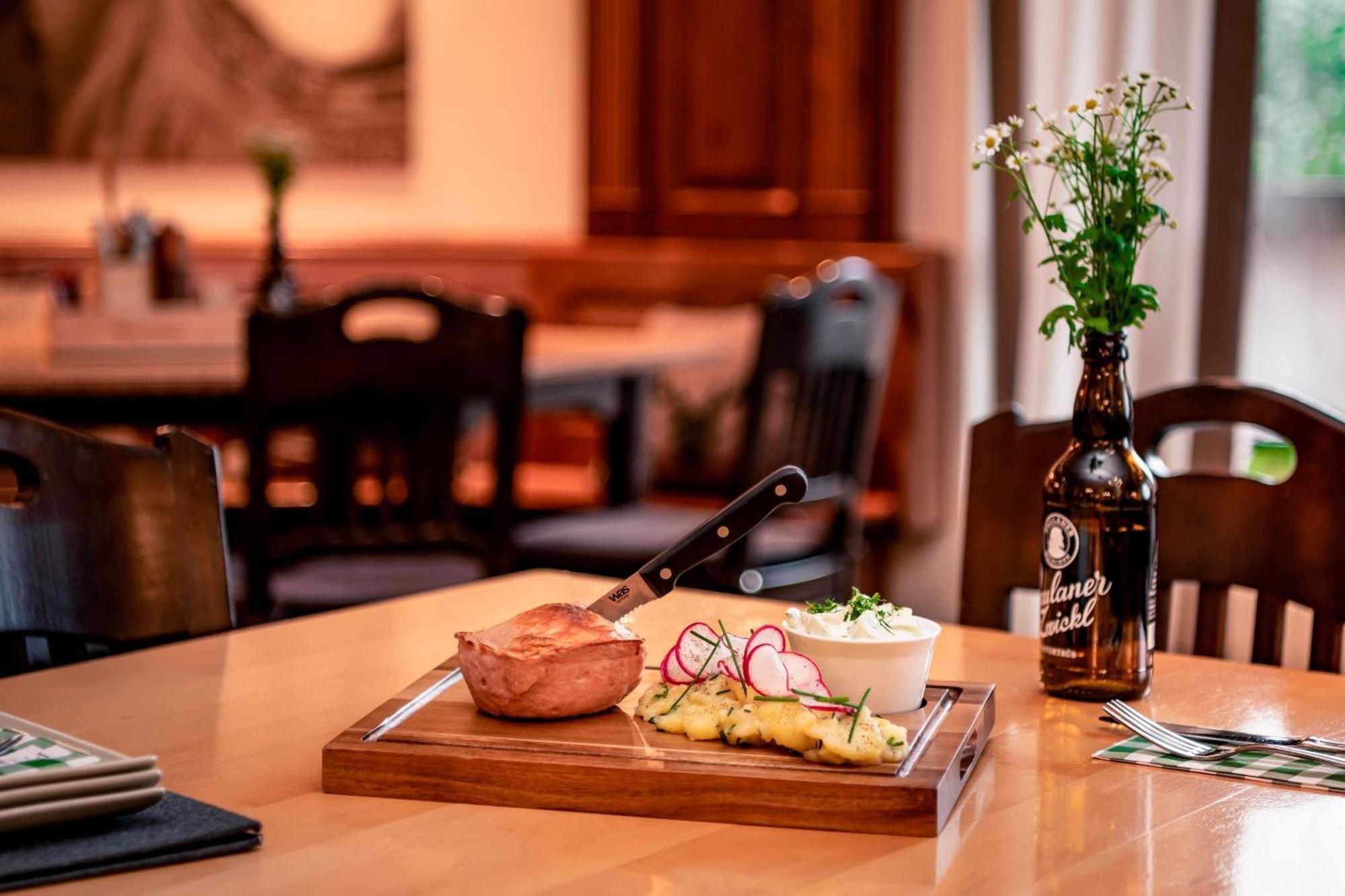 The Westin Grand Munich Hotel Exterior photo A traditional German meal with a bottle of Kölschstange