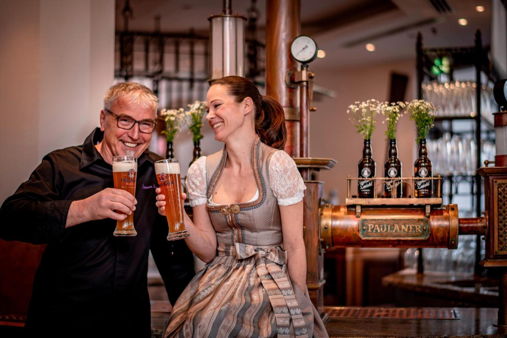 The Westin Grand Munich Hotel Exterior photo A woman in a dirndl